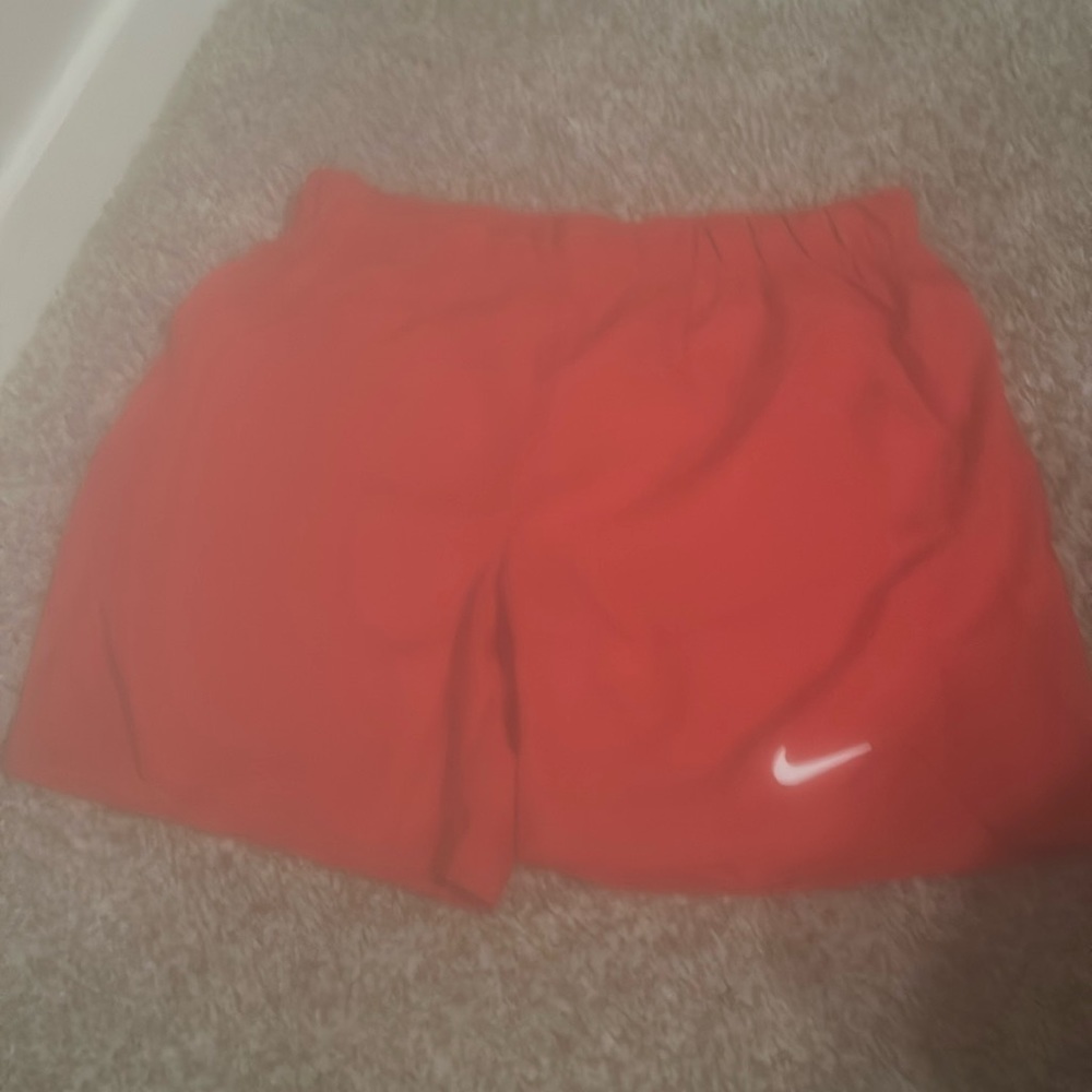 Red Nike athletic shorts